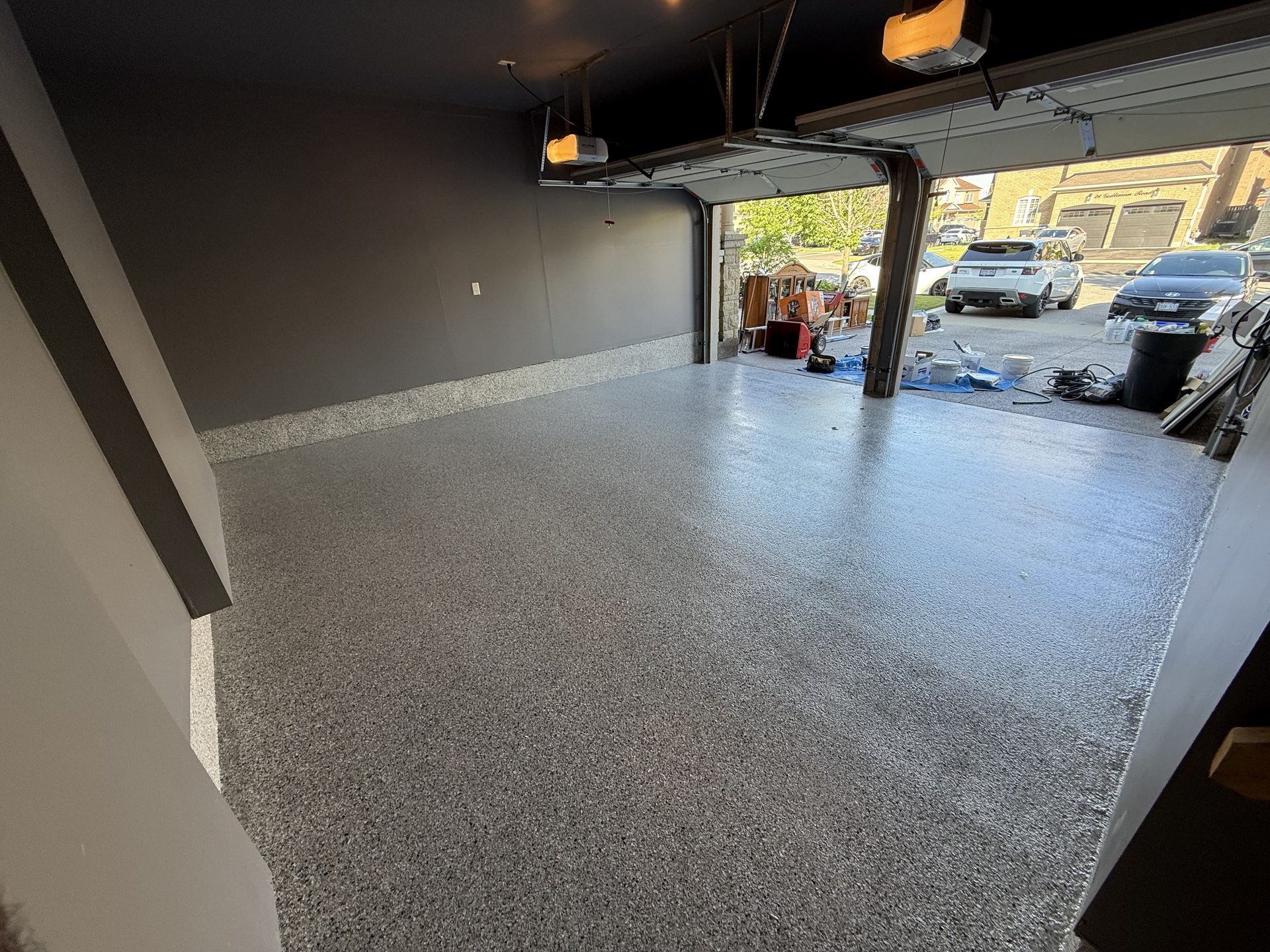 Light grey flake epoxy double-garage floor in the GTA by Titan Floor Systems